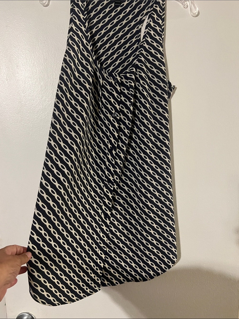 Aqua navy/cream sleeveless Aline tunic length top. Front button closure.